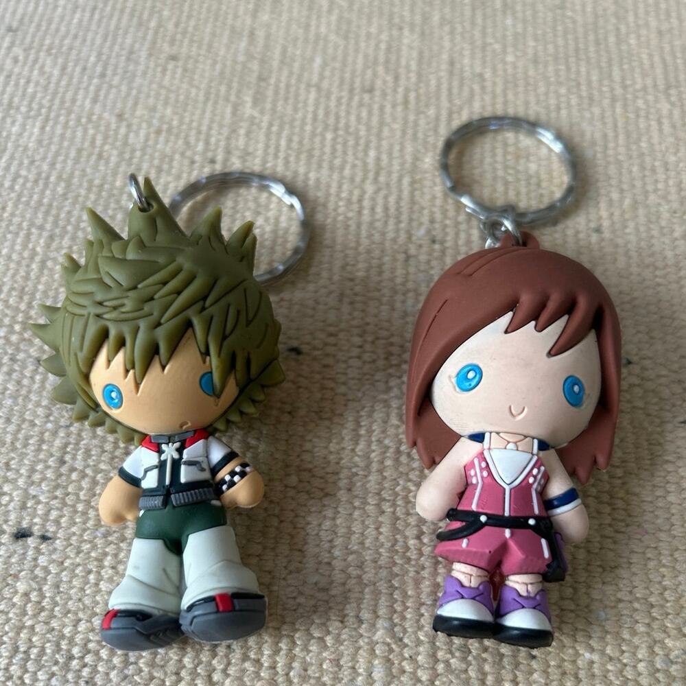 Kingdom Hearts Kairi Figural &  Kingdom Hearts Sad Sora Disney Keychain Set of 2